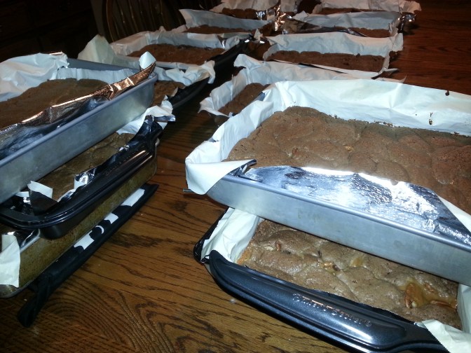 The parade of caramel brownies, cooling comfortably on our dining room table.