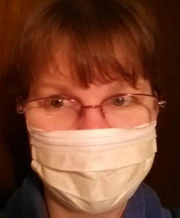 That would be me.... and, yes, I am smiling behind the mask.