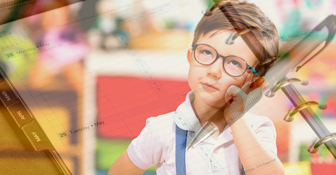 young boy ponders what he should be putting in his planner, open before him