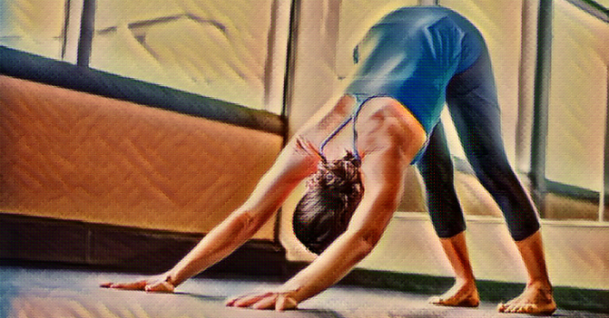 Woman in the downward dog position in yoga
