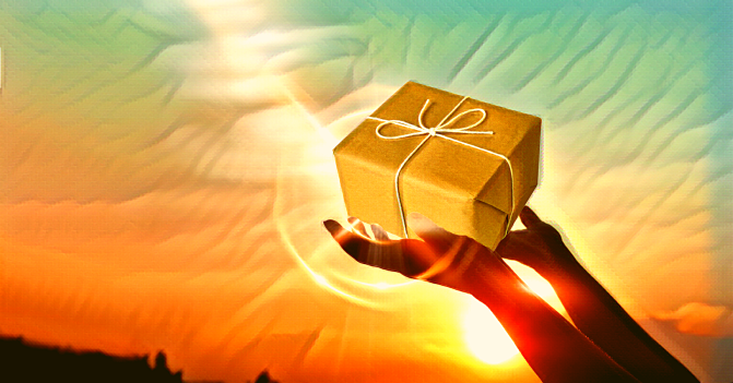 Hands hold up a care package to the heavens against the backdrop of a sunset or sunrise