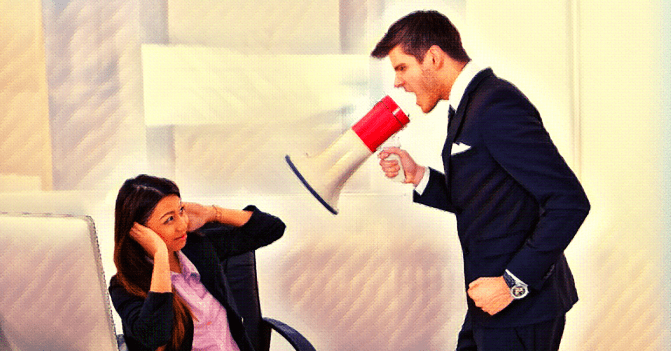 business man in a suit uses a megaphone to shout at a business woman sitting holding her ears. Photo illustration
