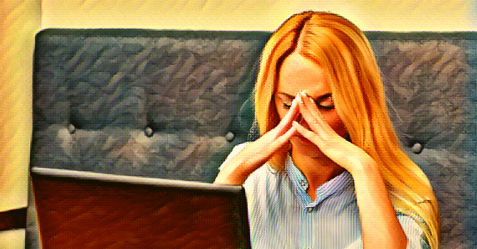 a woman sits at her laptop, fingertips together, her hands supporting the weight of her head. Her eyes are closed. Her burden is heavy. She is discouraged.