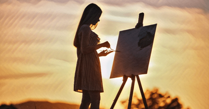 A young woman draws her paintbrush across a palette as she stands before a canvas capturing the sun as it sets over a picturesque hill